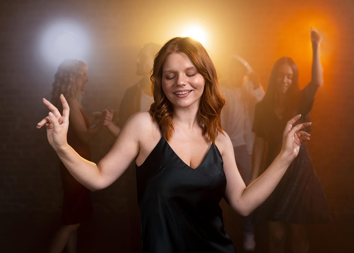 medium-shot-smiley-woman-dancing copy