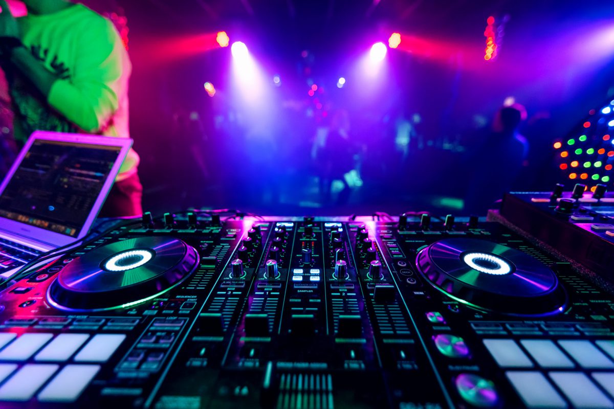 professional DJ music mixer at a party at an electronic music concert